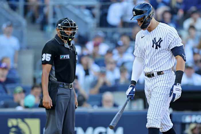 New York Yankees right fielder Aaron Judge (99) complains about a called strike three against the Cleveland Guardians with home plate umpire Jeremie Rehak (35) during the fifth inning in game two ... Brad Penner-USA TODAY Sports